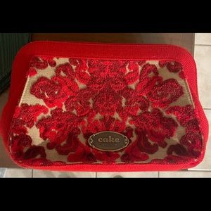 Cake by Petunia red purse, clutch, diaper bag. Like new.